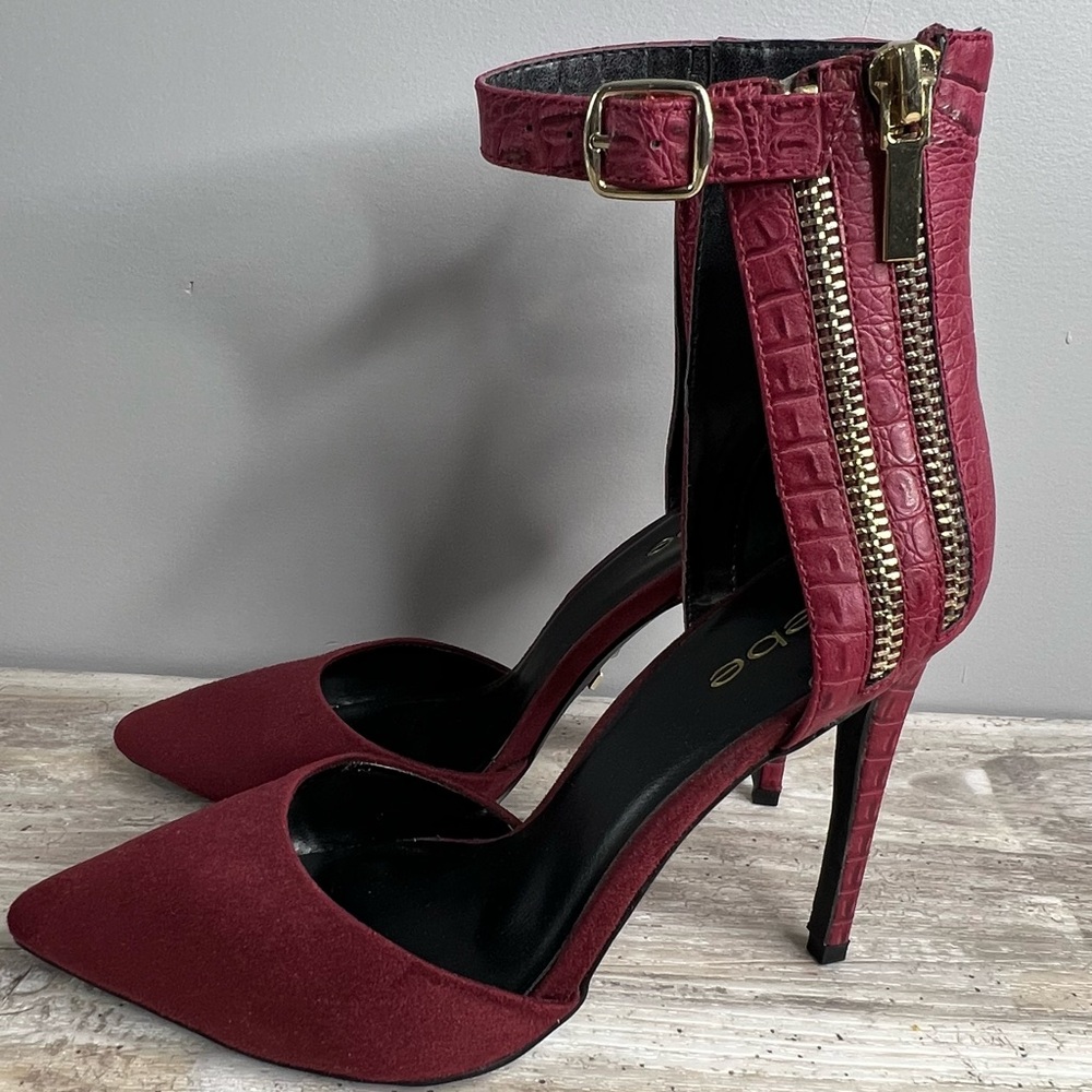 BEBE Women’s “Taliya” Burgundy Ankle Strap Heels